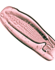 AA pale pink coloured drop of bubble bath lays on a white surface. the aroma is called Rose Soiree which smells like champagne, strawberries, cadarmom and vanilla and rose
